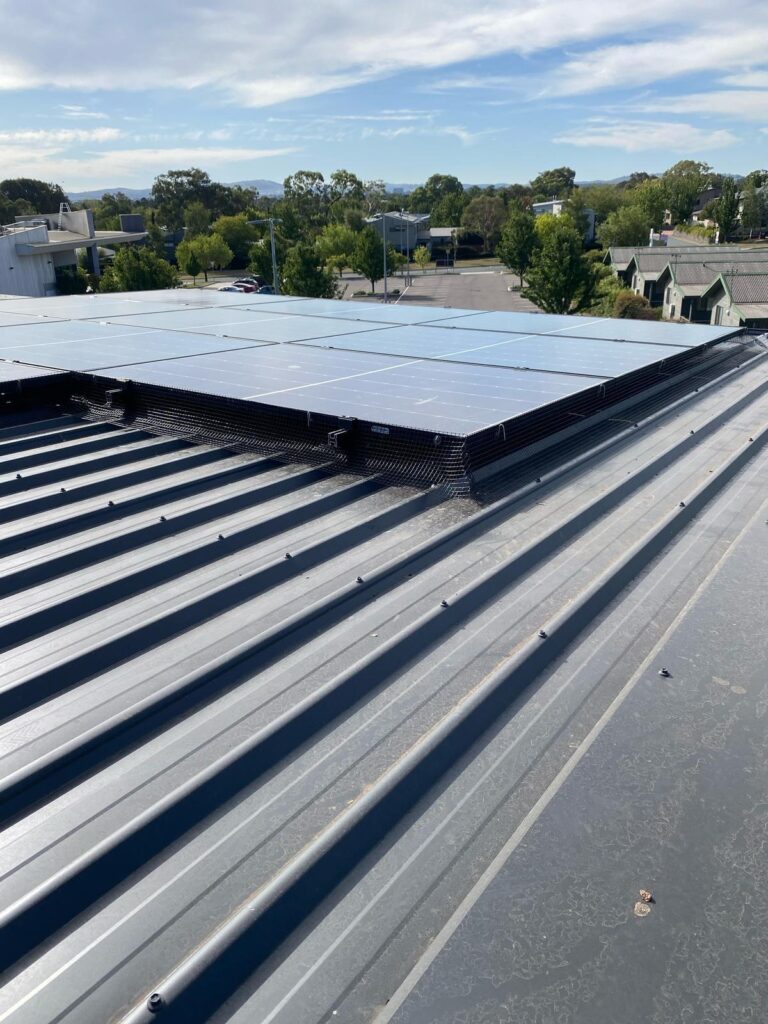 Solar panel mesh bird proofing Canberra roof close-up