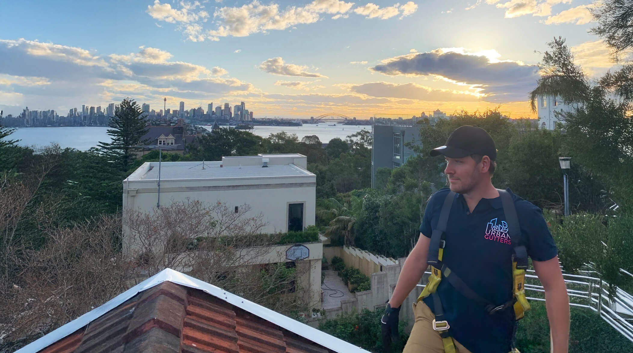 urban gutter cleaner sydney with city ion the background at sunset