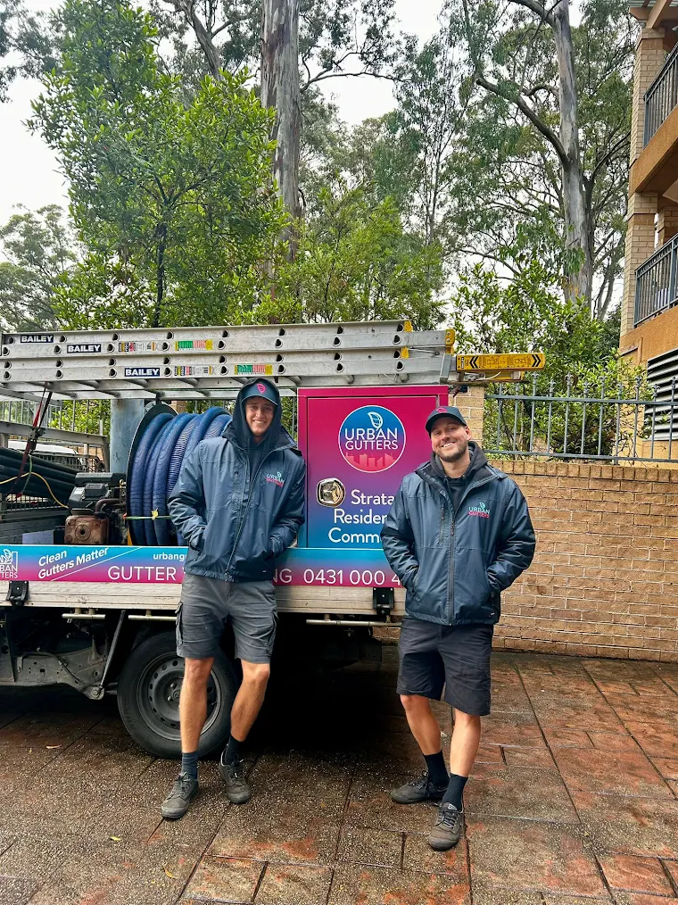 Urban Gutters team with industrial gutter vacuum truck on a commercial job in Sydney.